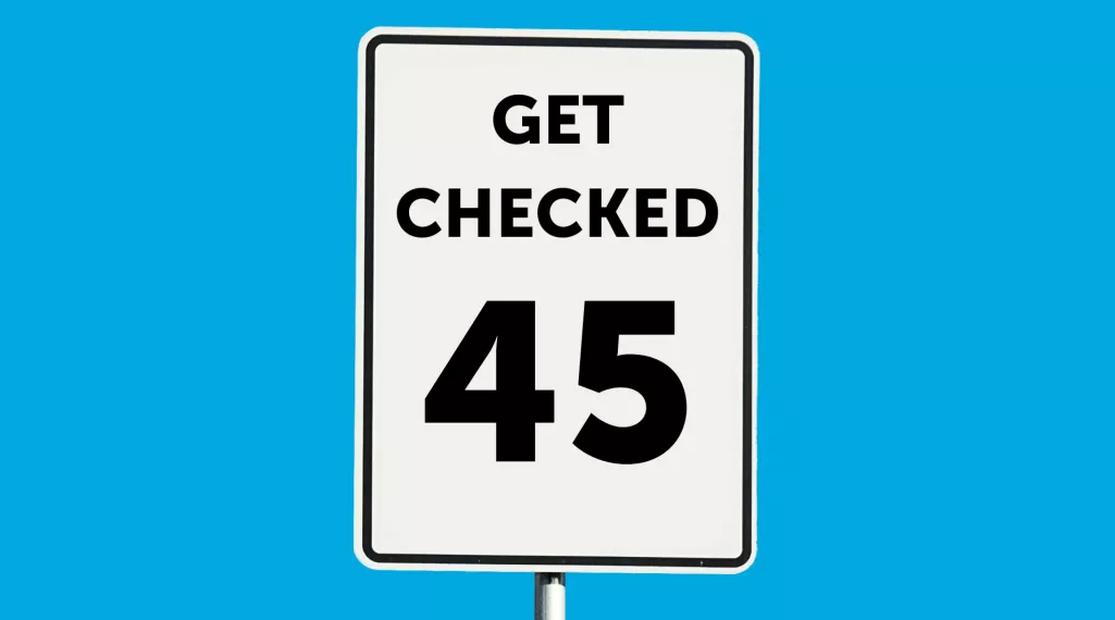 A speed limit road sign with the words "Get Checked" and the number "45."