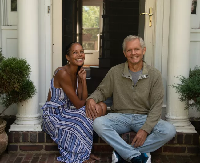 couple posing on front porch