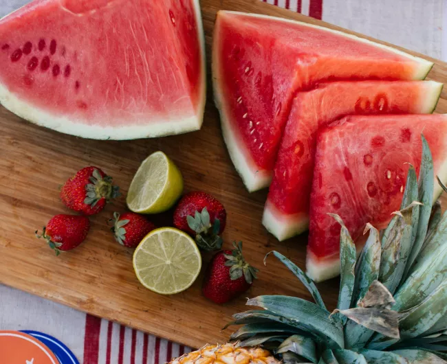 watermelon and pineapple on table